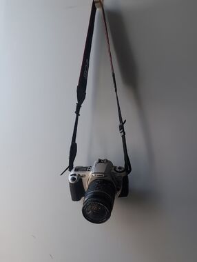 Vintage Canon Silver and Black Camera with Zoom Lens